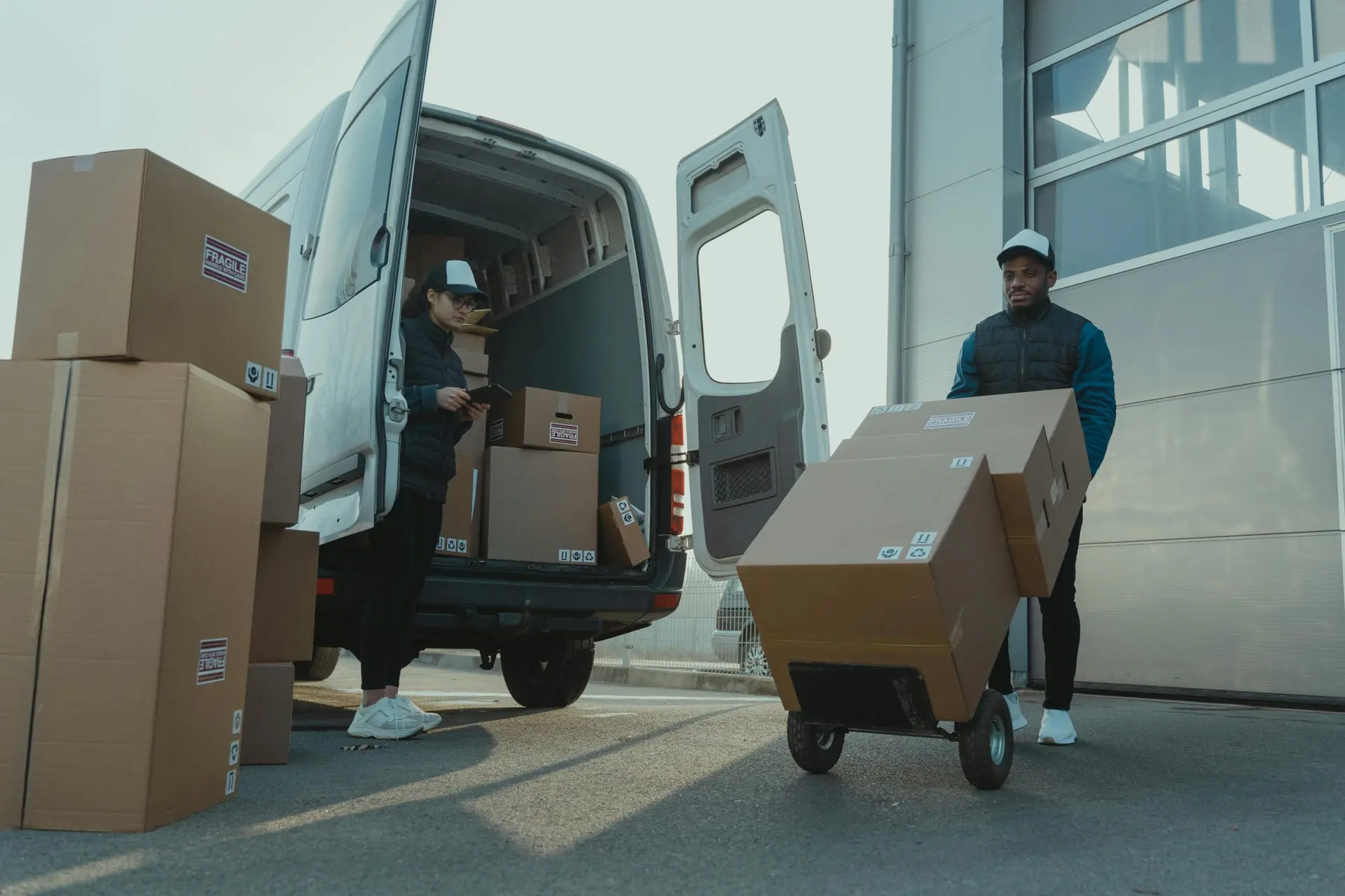 Nuvensa couriers loading pharmaceutical deliveries into a van