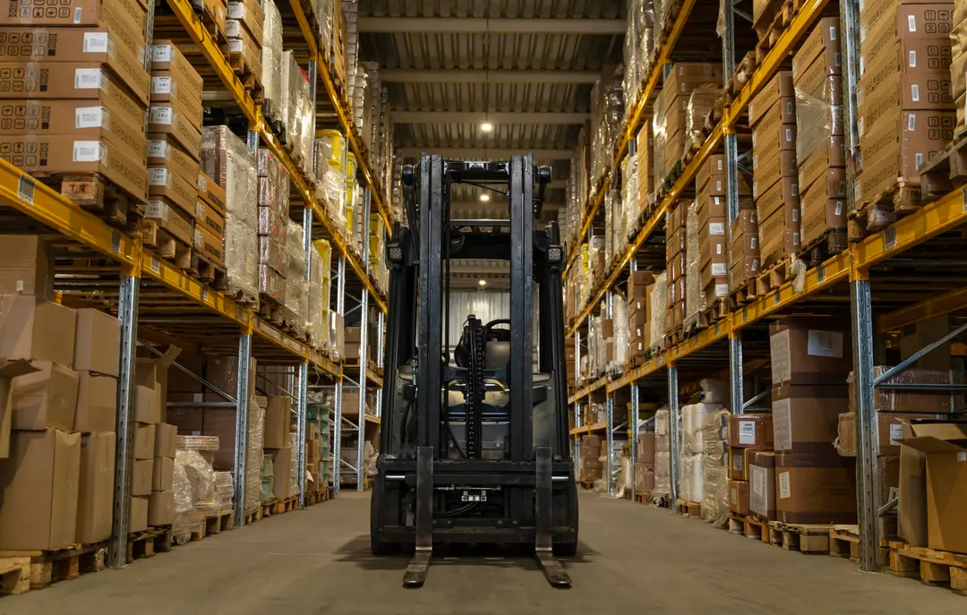 Forklift moving stock through a pharmaceutical warehouse